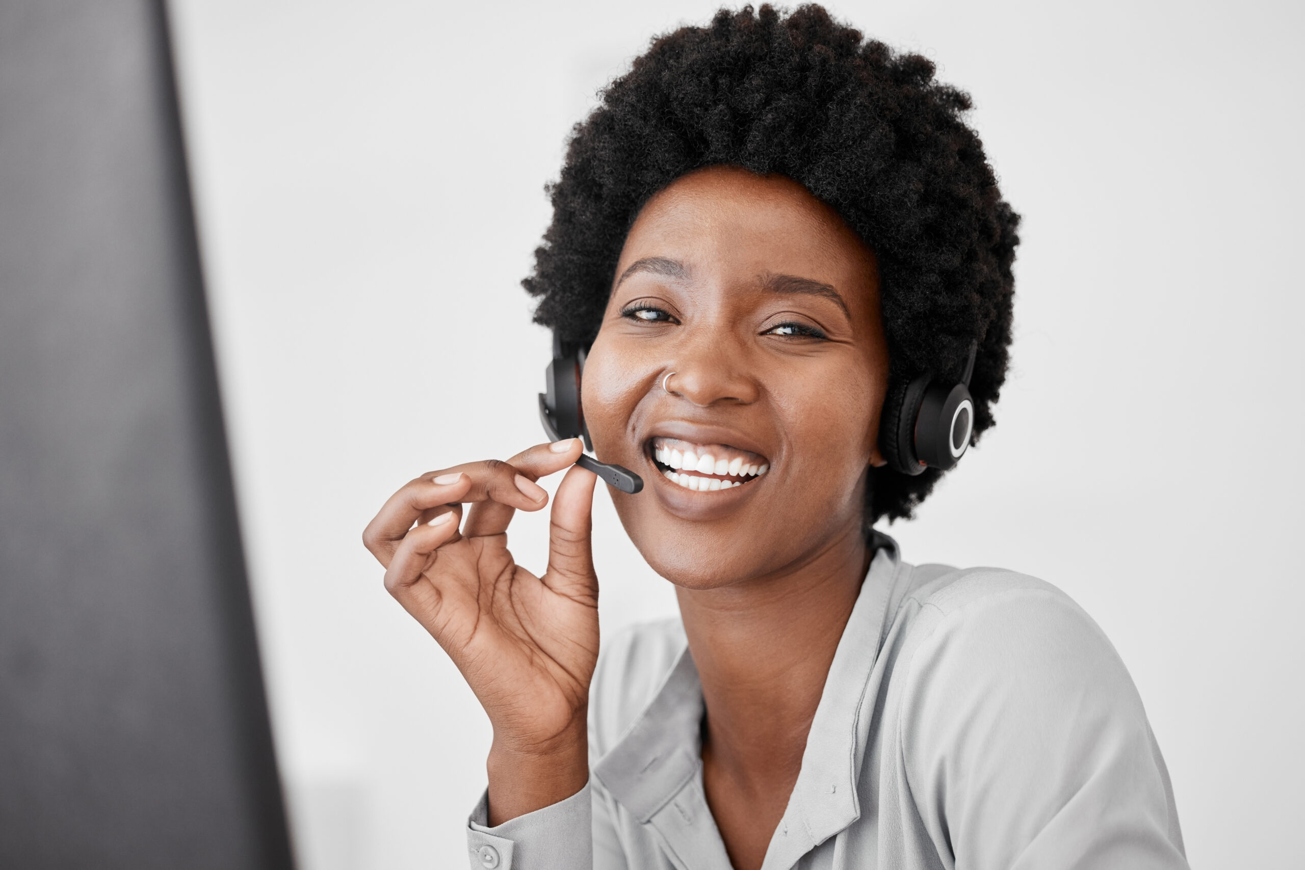 Customer support, call center and telemarketing with a woman consultant using a headset for communi